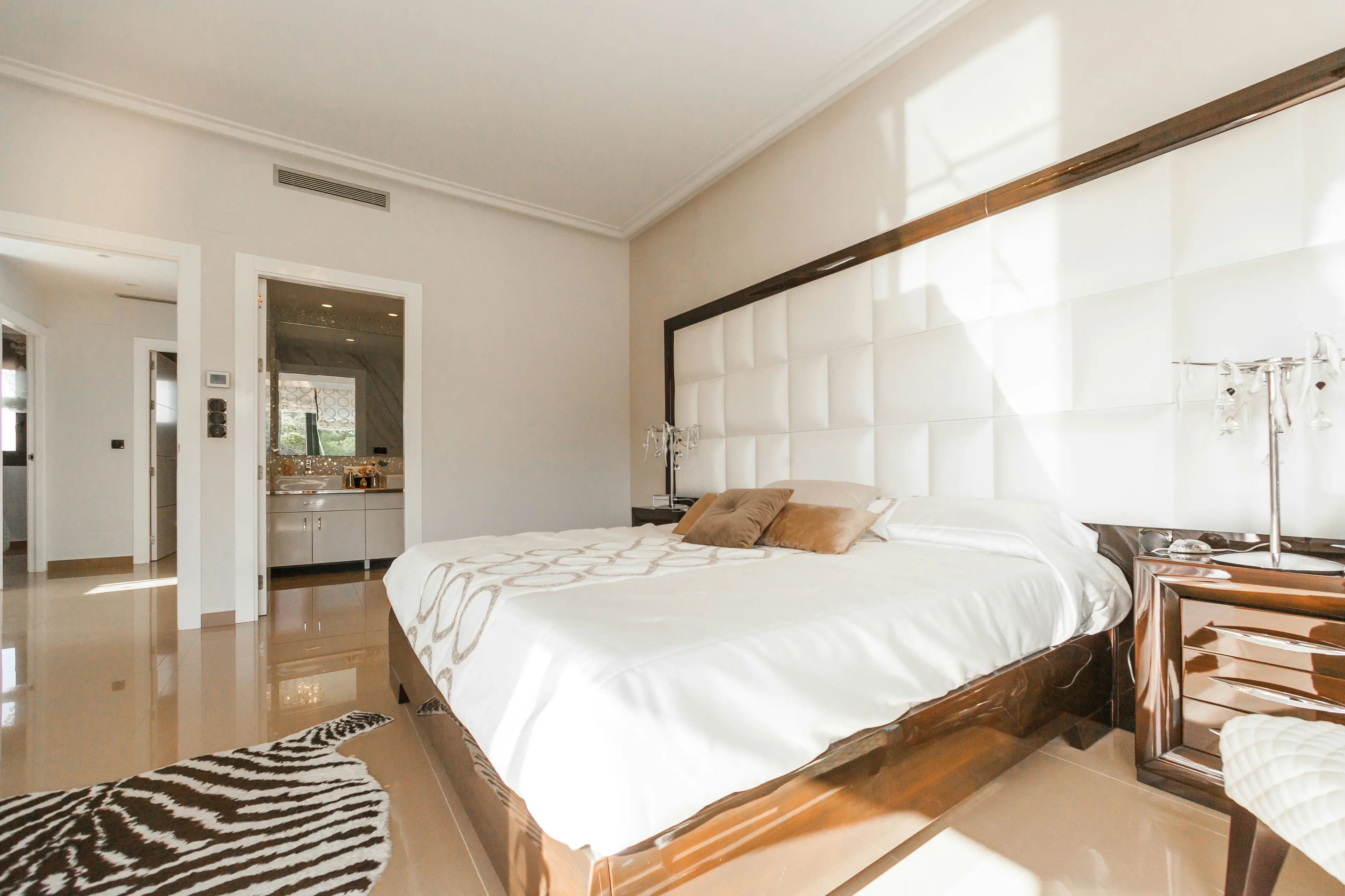 Deluxe Room · king bed, pool-view balcony, warm teak interiors
